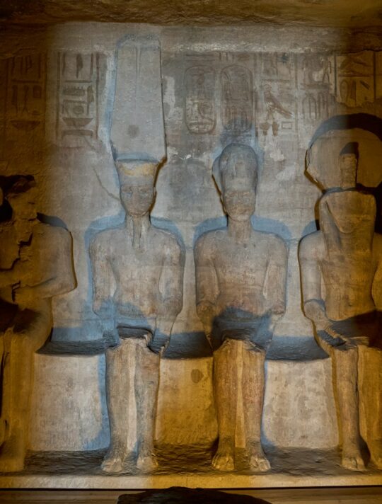 statues of pharaohs and queens in a room