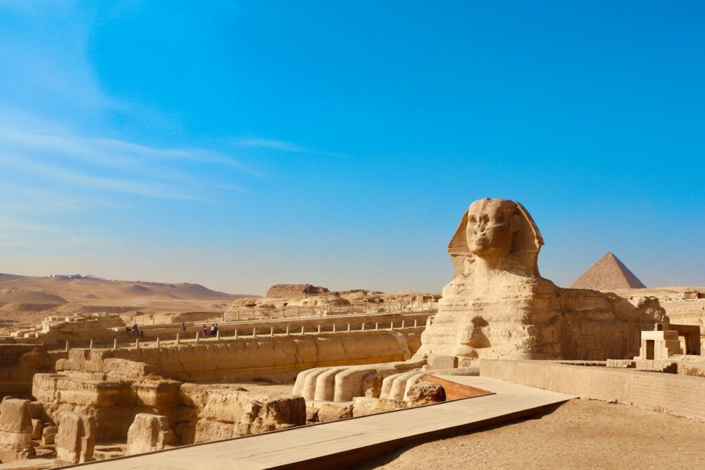 a large sphinx statue in the middle of a desert